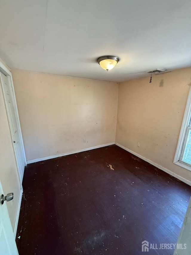 154 Townsend St, New Brunswick, NJ 08901 - empty room with baseboards and wood finished floors