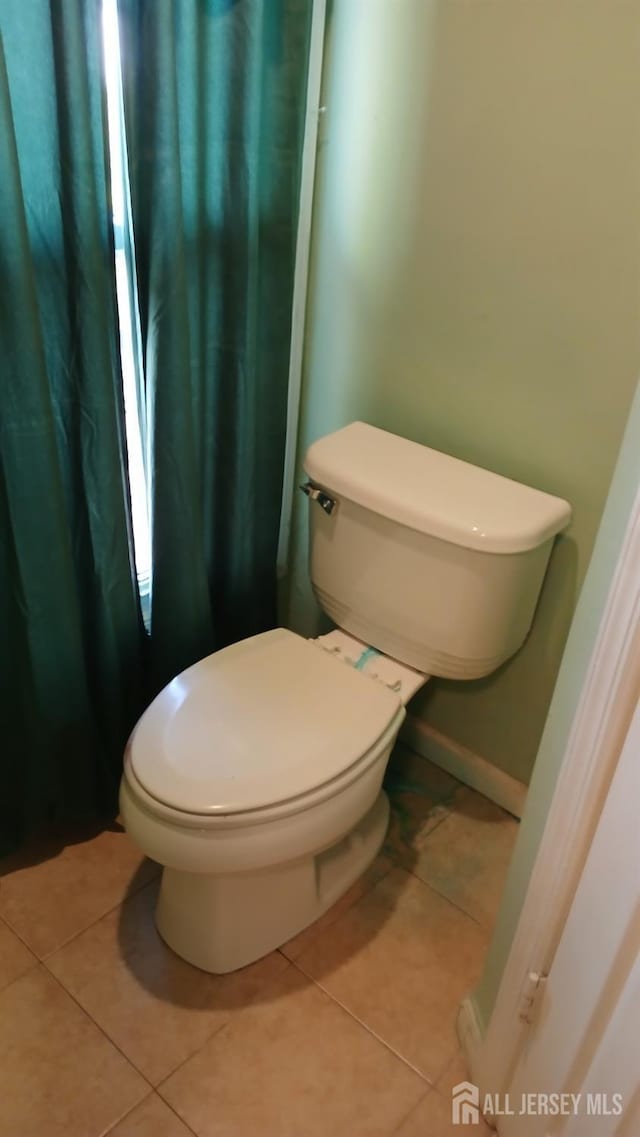 154 Townsend St, New Brunswick, NJ 08901 - bathroom featuring tile patterned flooring and toilet