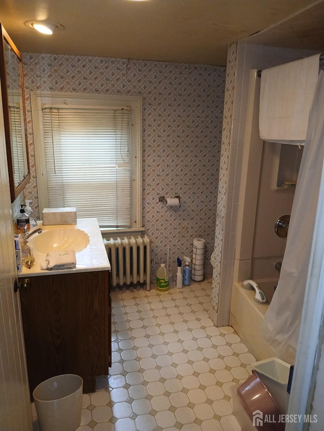 bathroom with vanity, radiator, and shower / tub combo with curtain