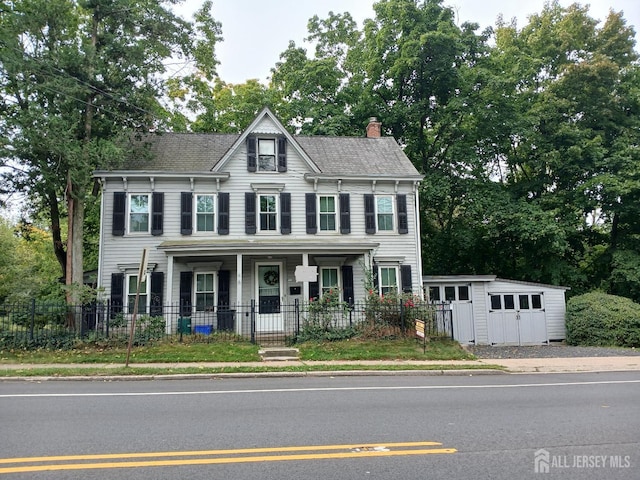 view of front of house featuring an outbuilding