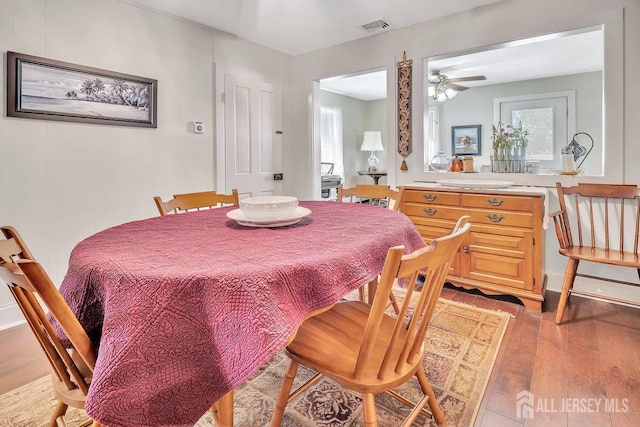 dining room with visible vents, ceiling fan, and light wood-style flooring