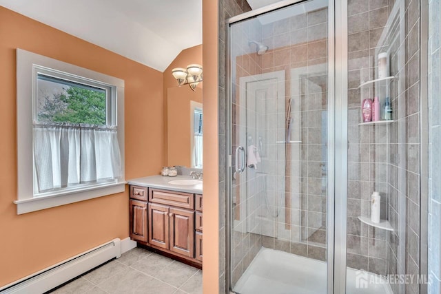 bathroom with a baseboard radiator, tile patterned floors, a shower stall, vanity, and lofted ceiling