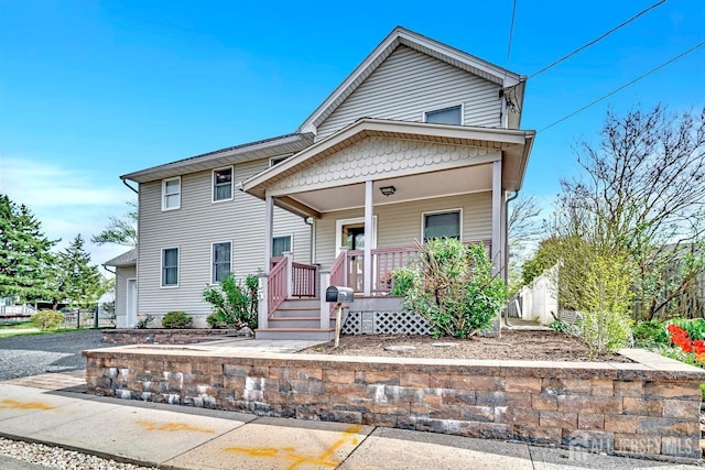 view of front of property featuring covered porch
