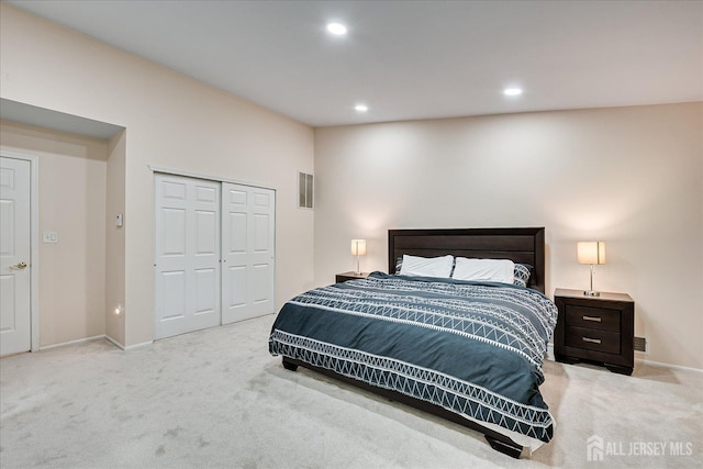 carpeted bedroom with a closet