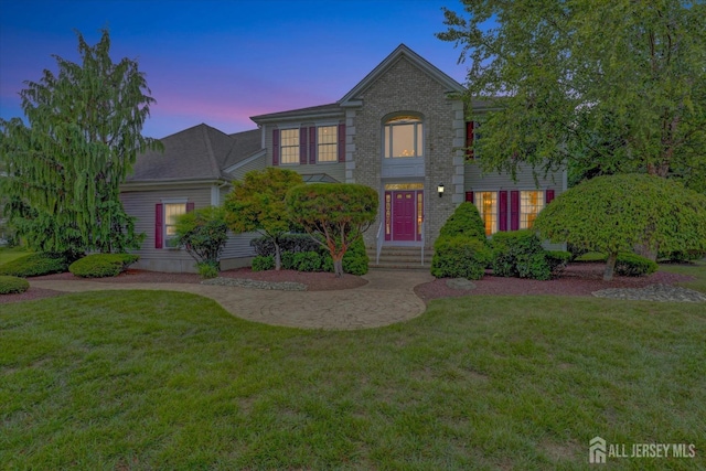 view of front of house with a yard