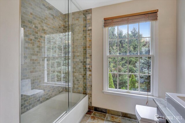 full bathroom featuring vanity, toilet, and enclosed tub / shower combo