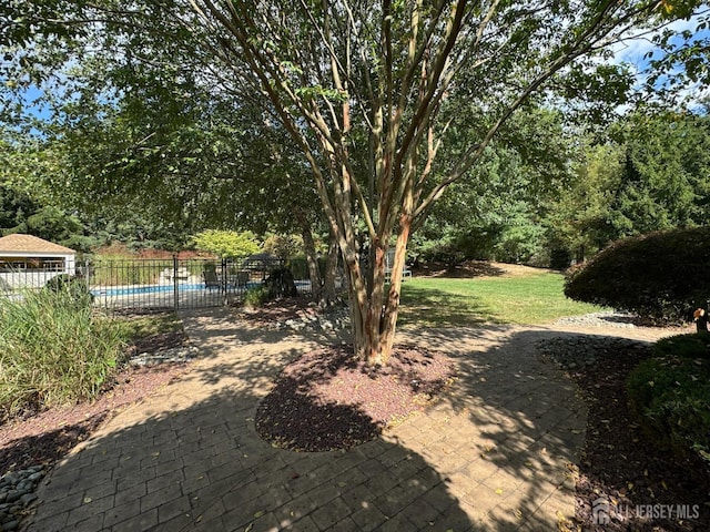 view of yard featuring a fenced in pool