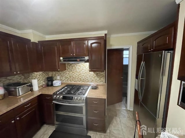 kitchen with backsplash, stainless steel appliances, and light tile patterned flooring