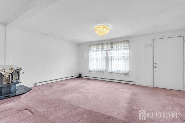 unfurnished living room with a baseboard radiator, carpet floors, and a wood stove