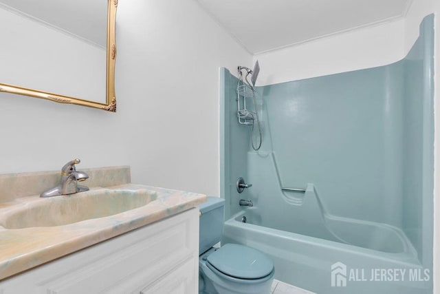bathroom with vanity, washtub / shower combination, toilet, and ornamental molding
