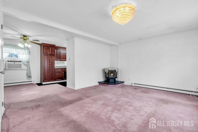 unfurnished living room featuring a wood stove, carpet, a baseboard radiator, cooling unit, and baseboard heating