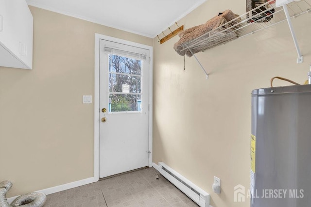 washroom with baseboard heating, electric water heater, baseboards, crown molding, and electric dryer hookup