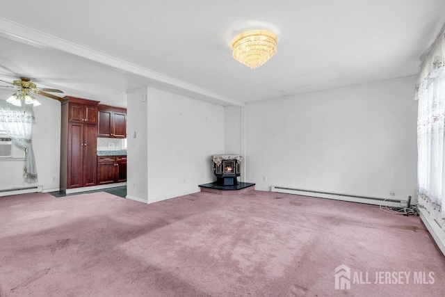 unfurnished living room with a baseboard radiator, a wood stove, carpet floors, ceiling fan, and baseboards