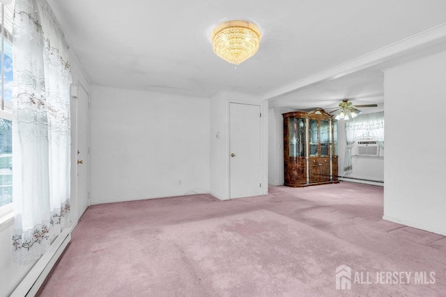 spare room with baseboard heating, carpet flooring, a baseboard heating unit, a ceiling fan, and cooling unit