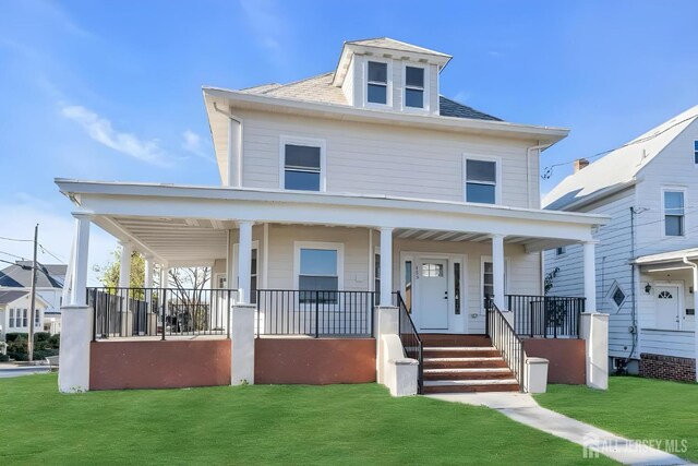 view of front facade with a front lawn and a porch