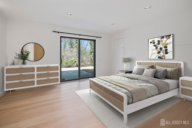 bedroom with access to outside, recessed lighting, and light wood-type flooring