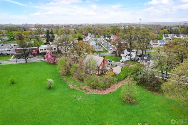 birds eye view of property with a residential view