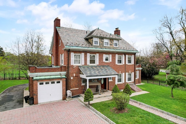 view of front facade featuring brick siding, a high end roof, and a chimney