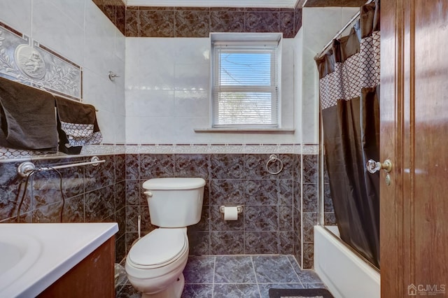 bathroom featuring vanity, tile walls, shower / tub combo, and toilet