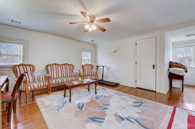 sitting room with visible vents and light wood-type flooring