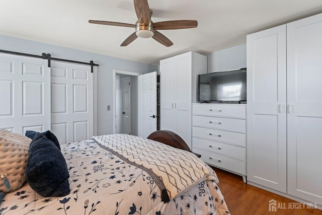 8 Martha Blvd, Sayreville, NJ 08879 - bedroom featuring multiple closets, wood finished floors, and a ceiling fan
