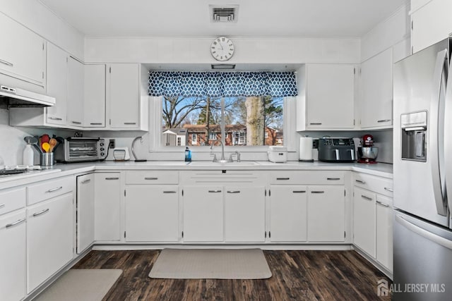 8 Martha Blvd, Sayreville, NJ 08879 - kitchen featuring stainless steel refrigerator with ice dispenser, a sink, light countertops, and white cabinetry