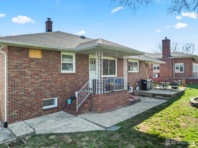 8 Martha Blvd, Sayreville, NJ 08879 - back of property featuring brick siding, a patio, and roof with shingles