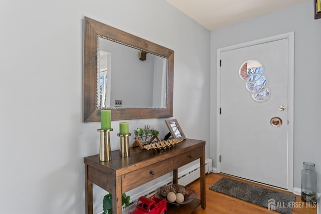 8 Martha Blvd, Sayreville, NJ 08879 - foyer entrance with wood finished floors and a baseboard heating unit