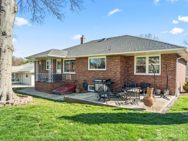 8 Martha Blvd, Sayreville, NJ 08879 - rear view of property featuring a chimney, brick siding, a yard, roof with shingles, and a patio