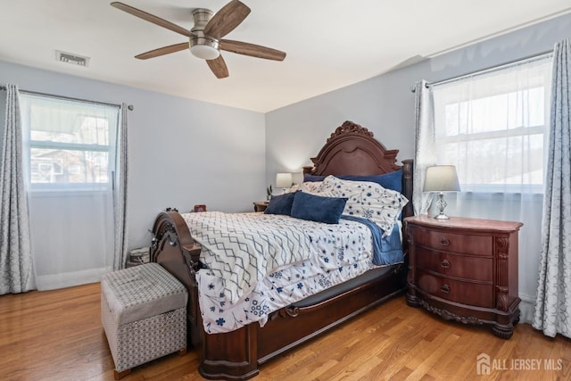 8 Martha Blvd, Sayreville, NJ 08879 - bedroom with multiple windows, wood finished floors, and a ceiling fan