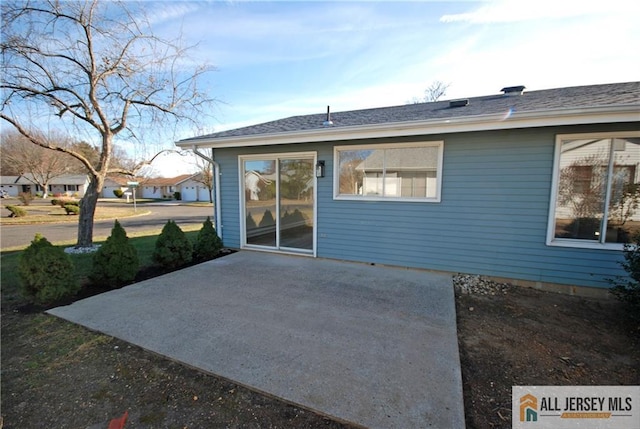 rear view of property with a patio area