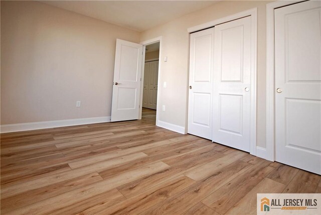 unfurnished bedroom featuring light hardwood / wood-style floors