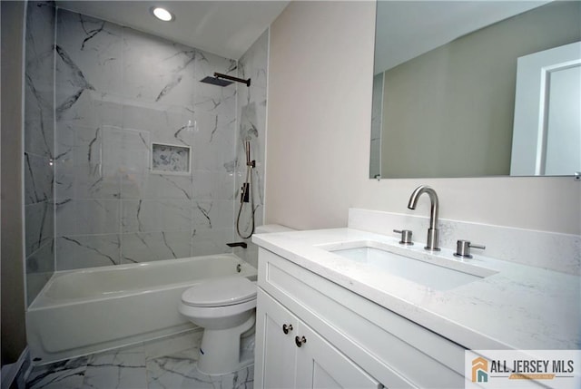 full bathroom with toilet, tiled shower / bath, and vanity