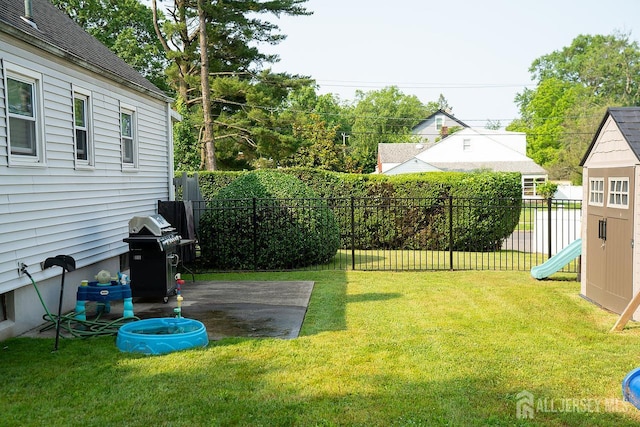 1457 George St Unit 61, Plainfield, NJ 07062 - fenced backyard with a playground and a patio area
