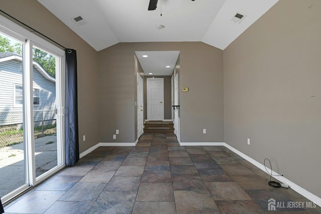 385 Shoreland Cir, Old Bridge, NJ 08879 - empty room with ceiling fan, lofted ceiling, and dark stone finish flooring
