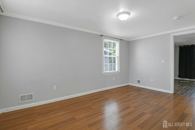 385 Shoreland Cir, Old Bridge, NJ 08879 - unfurnished room with a smoke detector, wood finished floors, and crown molding