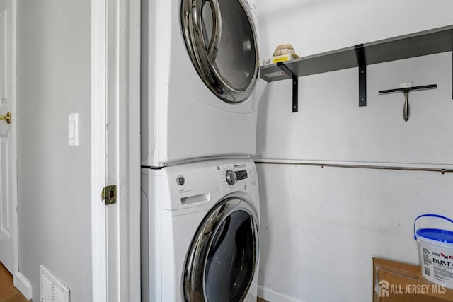 385 Shoreland Cir, Old Bridge, NJ 08879 - washroom with stacked washer / dryer