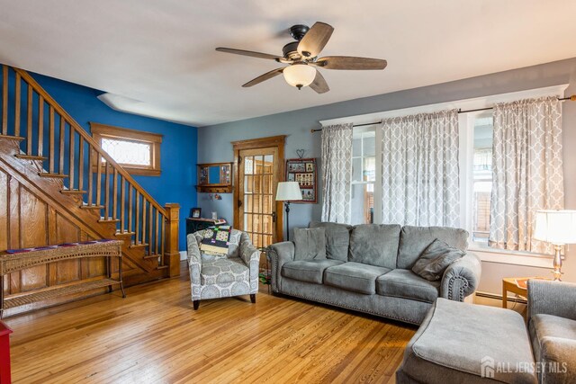 177 Hillside Ave, South River, NJ 08882 - living area with stairs, healthy amount of natural light, a ceiling fan, and hardwood / wood-style floors