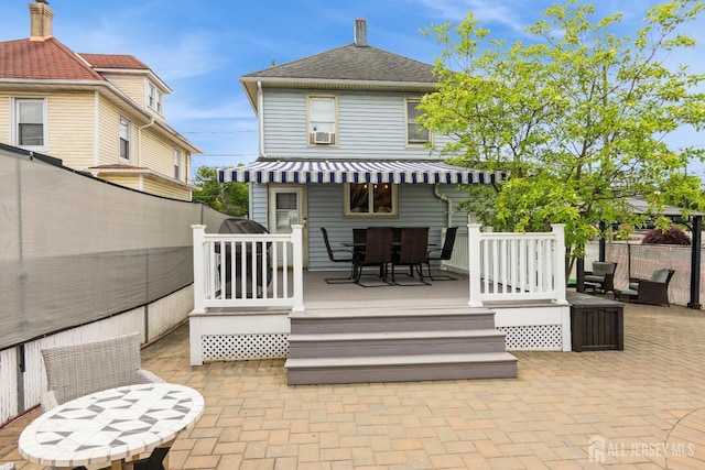 177 Hillside Ave, South River, NJ 08882 - back of property with a patio area, cooling unit, a shingled roof, outdoor dining area, and a deck