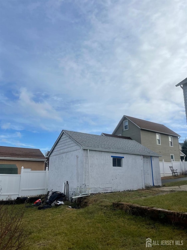 view of side of property with a lawn