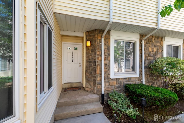 1103 Schmidt Ln, North Brunswick, NJ 08902 - view of exterior entry featuring stone siding