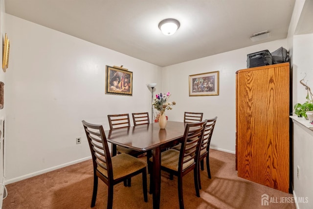 1103 Schmidt Ln, North Brunswick, NJ 08902 - carpeted dining space with baseboards