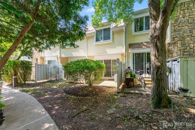 1103 Schmidt Ln, North Brunswick, NJ 08902 - rear view of house featuring a patio