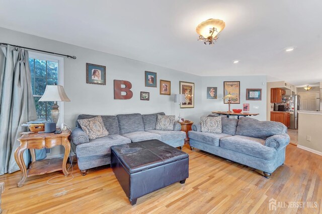 living room with light hardwood / wood-style floors