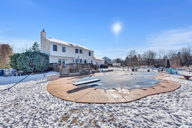 exterior space with a pool side deck and a patio area