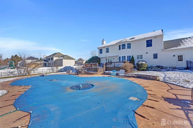 view of swimming pool featuring a deck