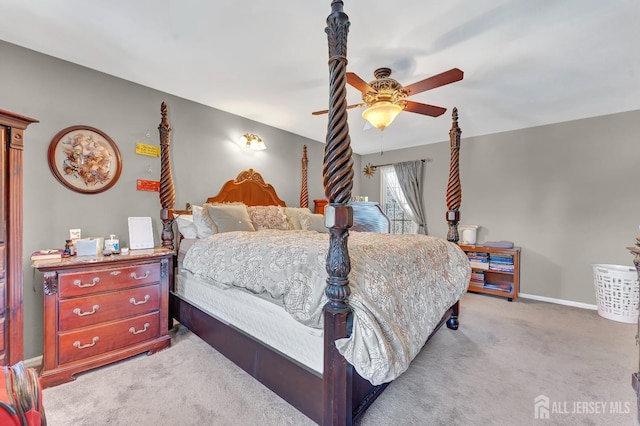 bedroom with light carpet and ceiling fan