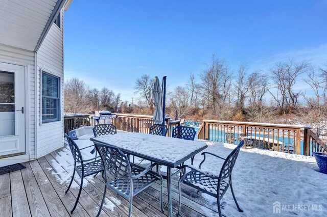 view of snow covered deck