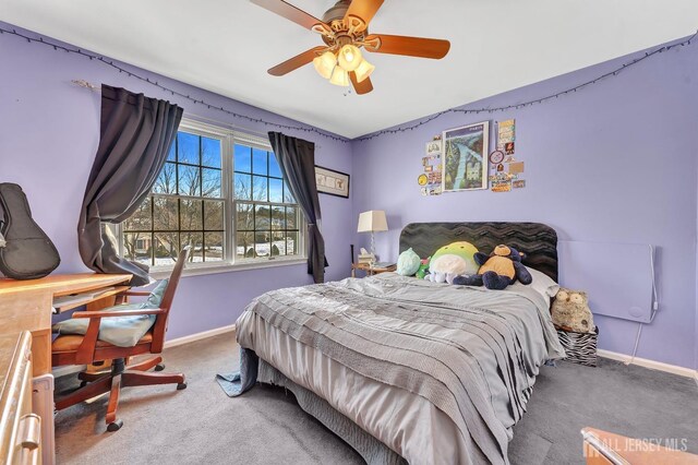 bedroom with ceiling fan and carpet flooring