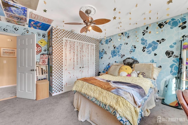 bedroom with a closet, ceiling fan, and carpet